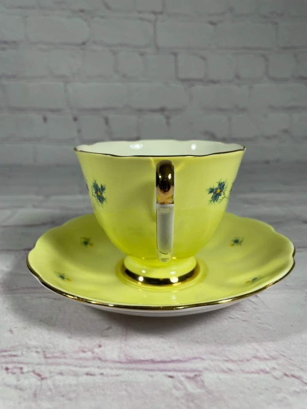 Vintage Yellow and Blue Floral Gold Trim Bone China Footed Teacup and Saucer Set